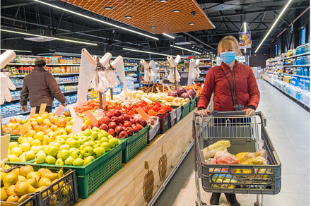 Woman buys groceries at the, a Person Photo by yanadjana