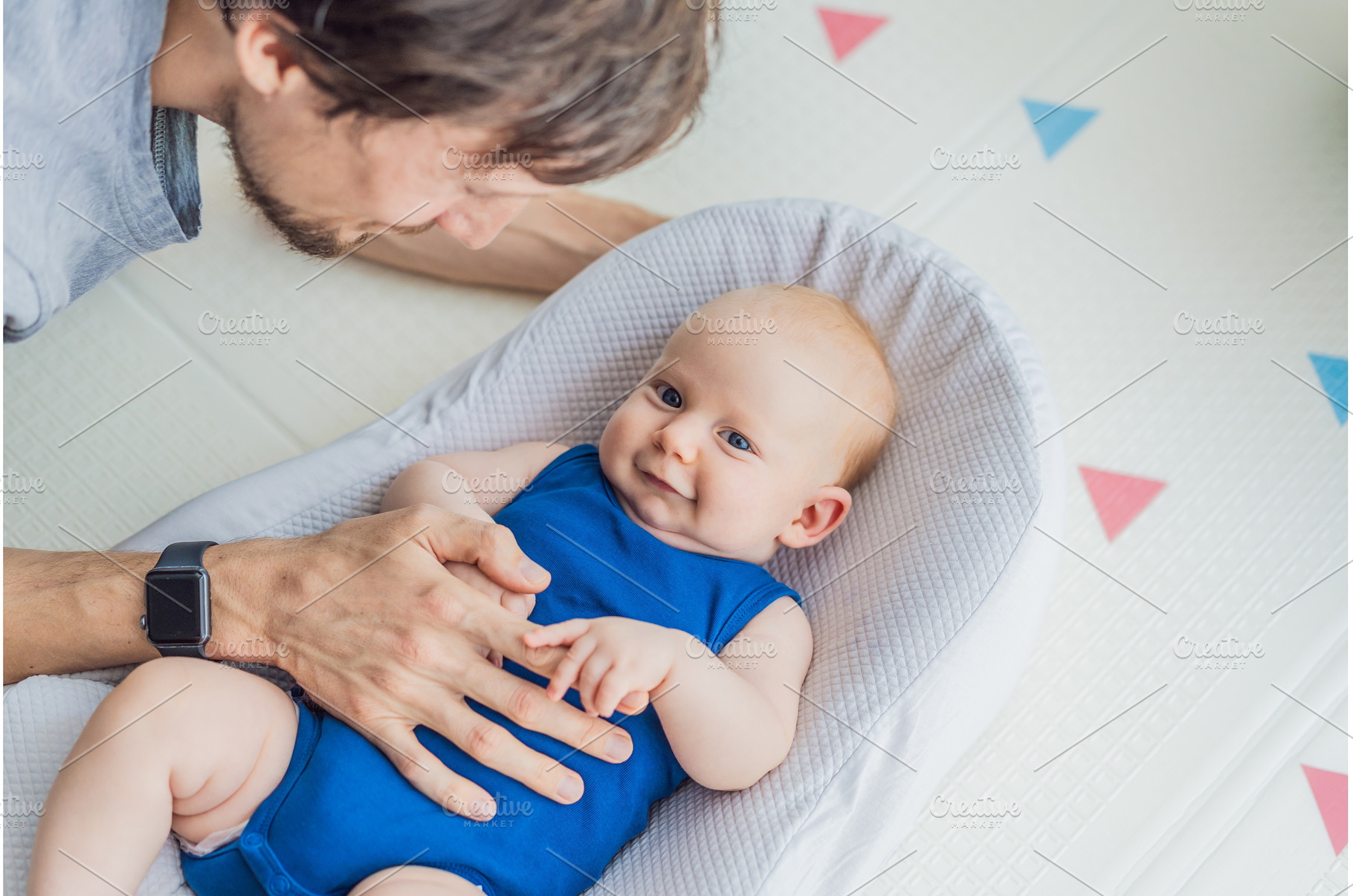 Loving father interacts with his 3, a Person Photo by Elizaveta Galitskaya