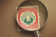 Postage Stamp Under Magnifying Glass, an Advertising Mockup by Custom Scene (Thumbnail 3 of 11)