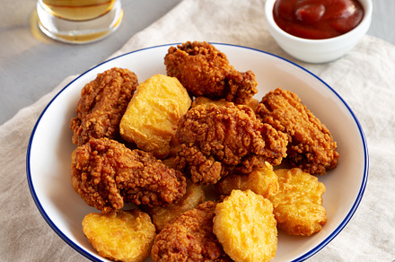 Homemade Chicken Nuggets and Chicken Wings with Ketchup and Beer, a Food & Drink Photo by LiudmylaChuhunova