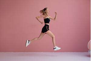 Young athletic woman mid air, full, a Sports & Recreation Photo by undrey