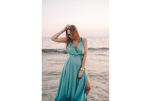 Woman in Flowing Dress on Seaside, a Person Photo by Jan Jack Russo Media