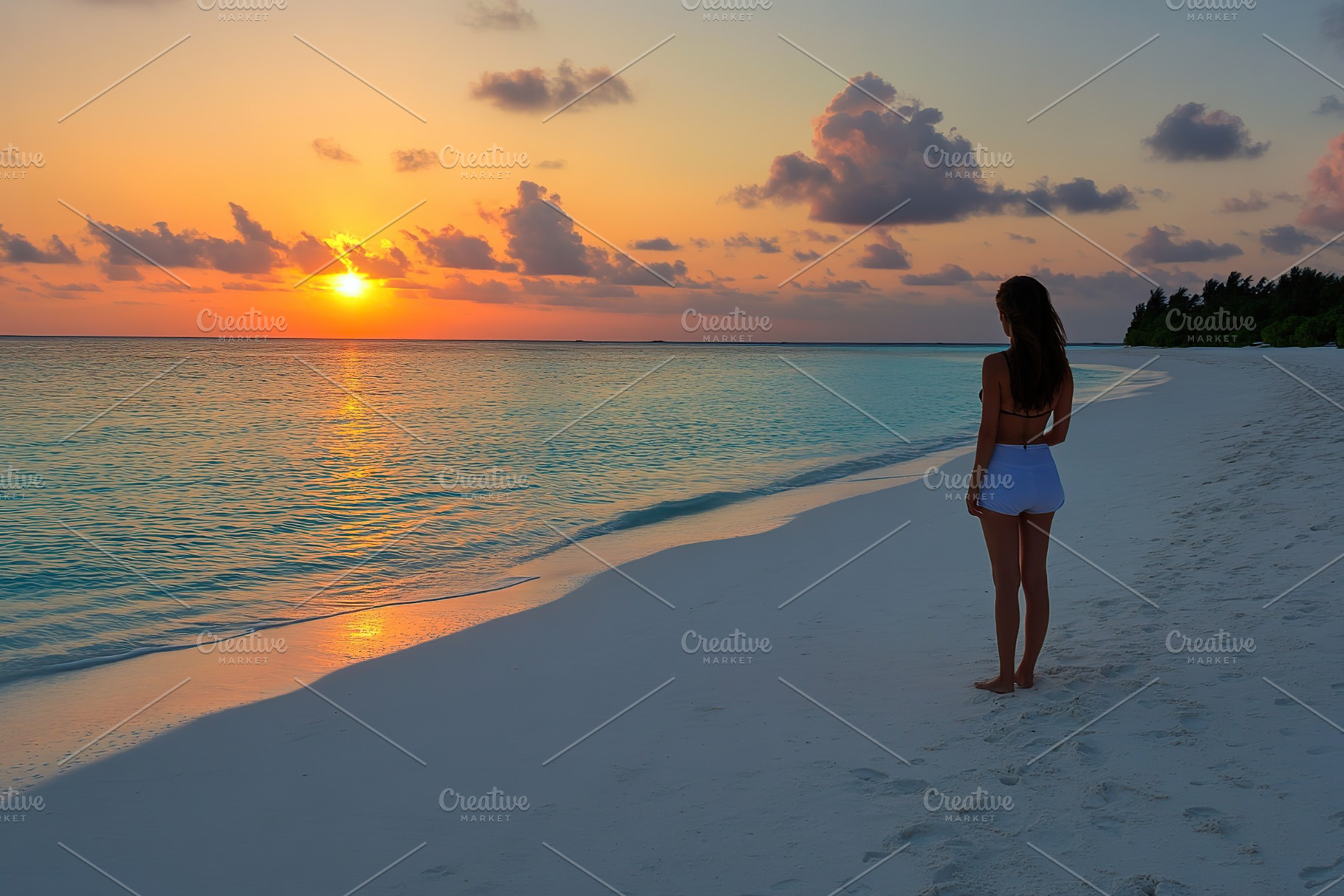 Woman stands by the shore enjoying the vibrant sunset over tranquil waters, a Photo by AlyaAnd