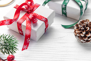 Christmas gifts wrapping on white wooden background, a Holiday Photo by Olena Rudo