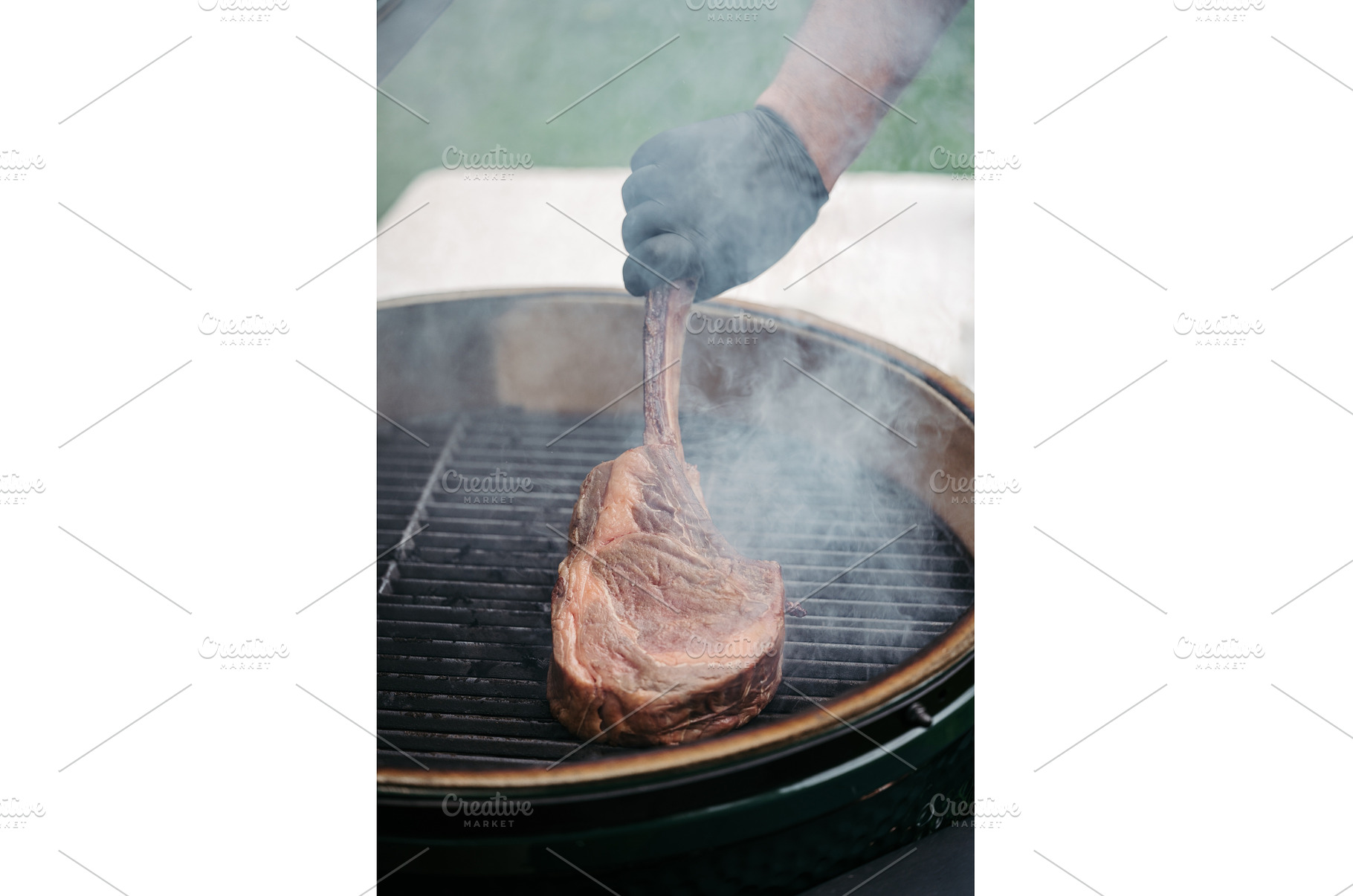Grilling juicy Tomahawk steak on, a Food & Drink Photo by HalfPoint