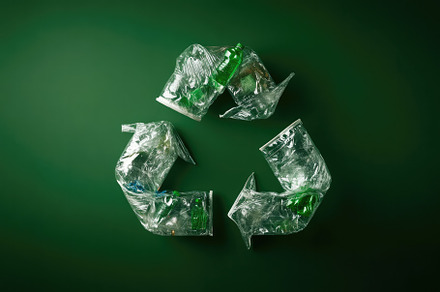 Recycling Symbol in Plastic Bottles, an Industrial Photo by Virgo Studio
