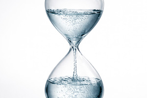 a water hourglass marking time, generative AI, a Photo by Nito