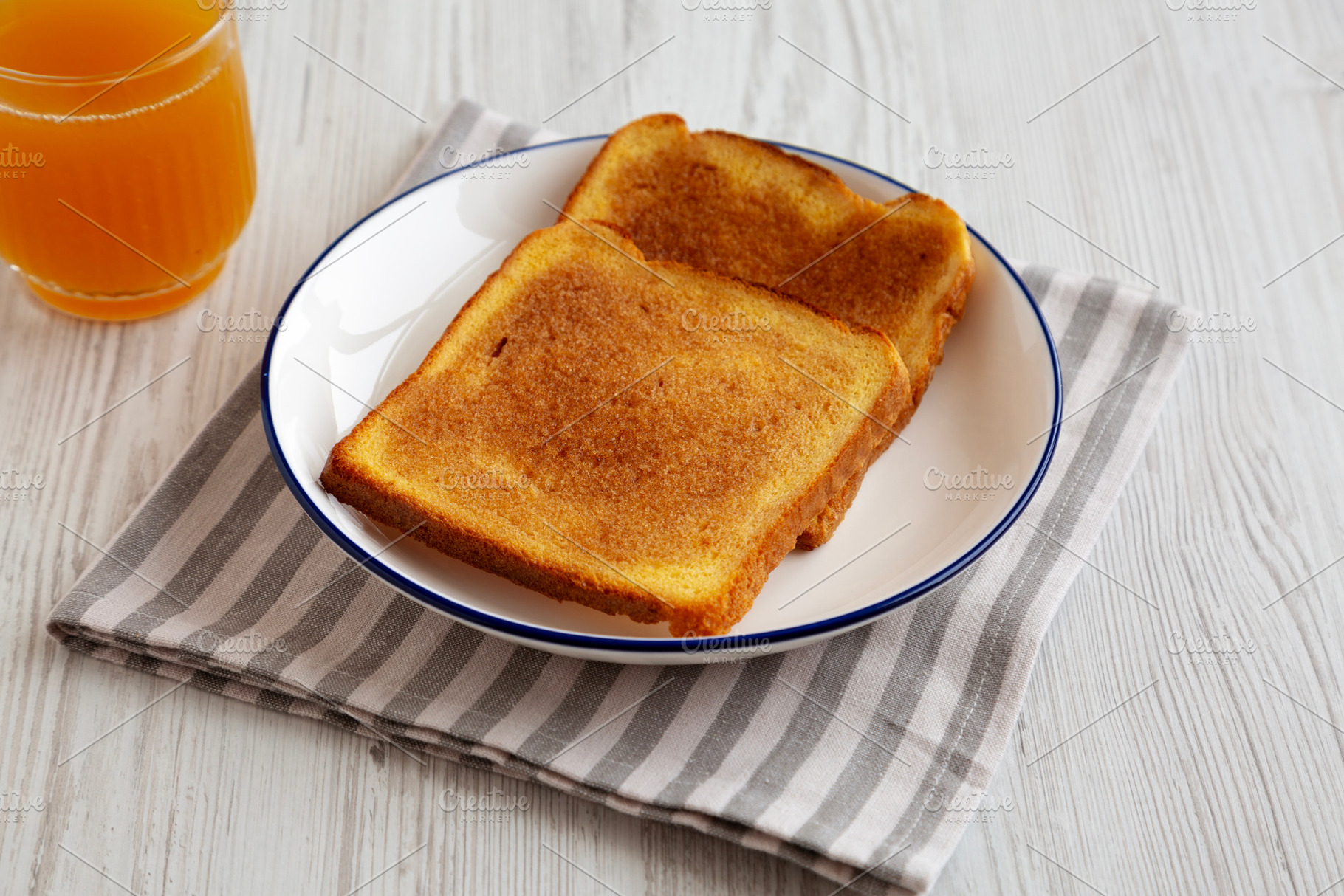Homemade American Cinnamon Toast with Butter and Orange Juice, s, a Food & Drink Photo by LiudmylaChuhunova