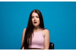 Young woman showing surprise emotion, a Person Photo by volodymyrshtun13795