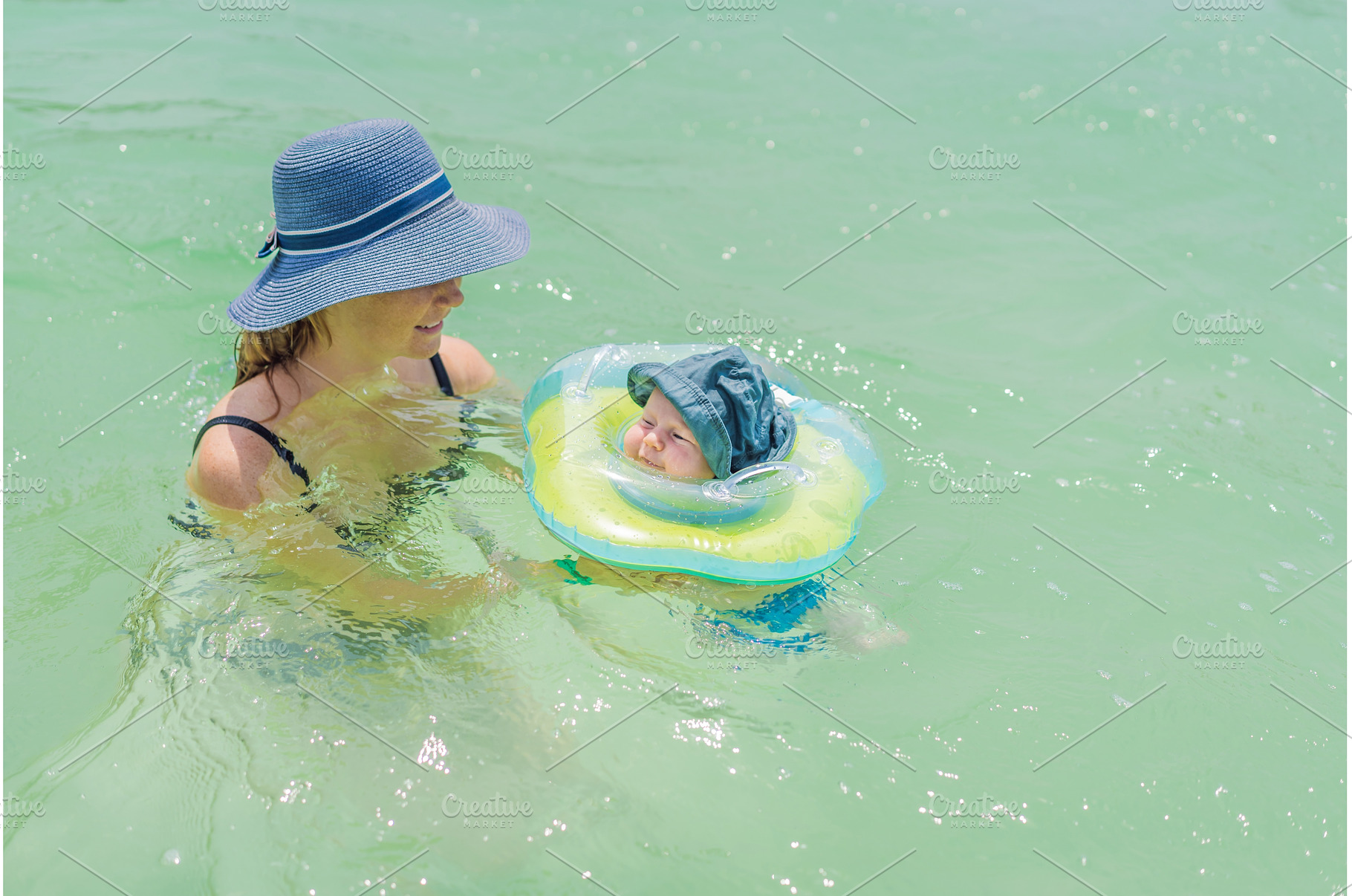 Baby floating in a neck ring in, a Person Photo by Elizaveta Galitskaya