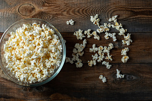 Popcorn on wood color background.Food and snack concepts ideas.Minimal style to, a Food & Drink Photo by Budarinphoto
