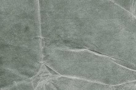 Grungy paper texture containing abstract, aged, and ancient