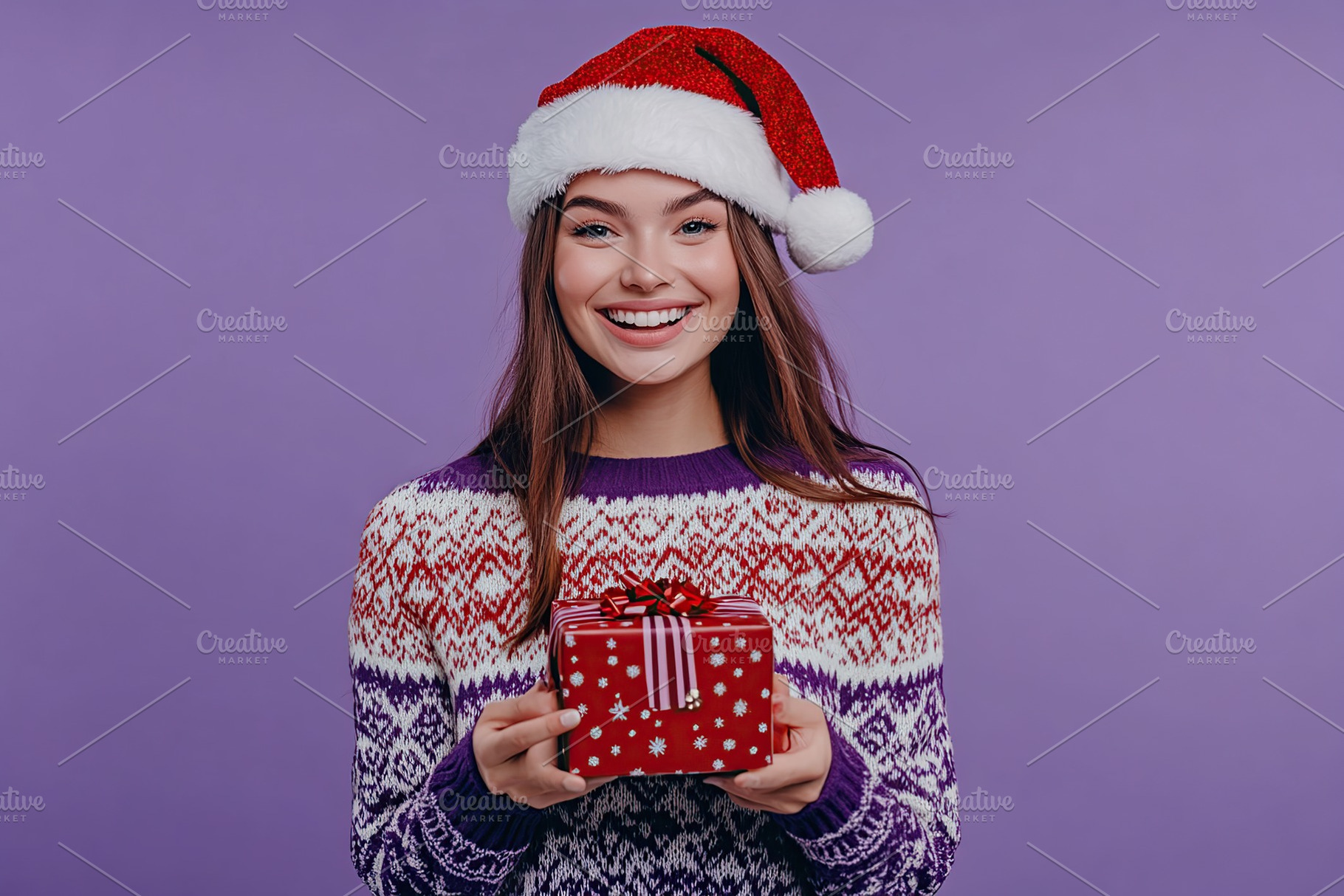 Cute young woman in knitted christmas sweater and santa hat holding in hands gi, a Person Photo by AlyaAnd