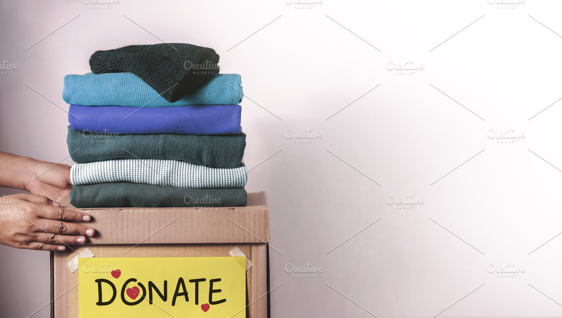 Clothes Donation, Renewable Concept,Hands folding and packing cl, a Photo by salmon.black