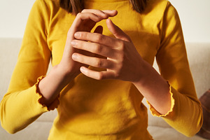 Teenage girl practicing EFT tapping - emotional freedom techniqu