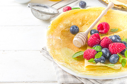 Crepes pancakes with berries, a Background Photo by Rimma