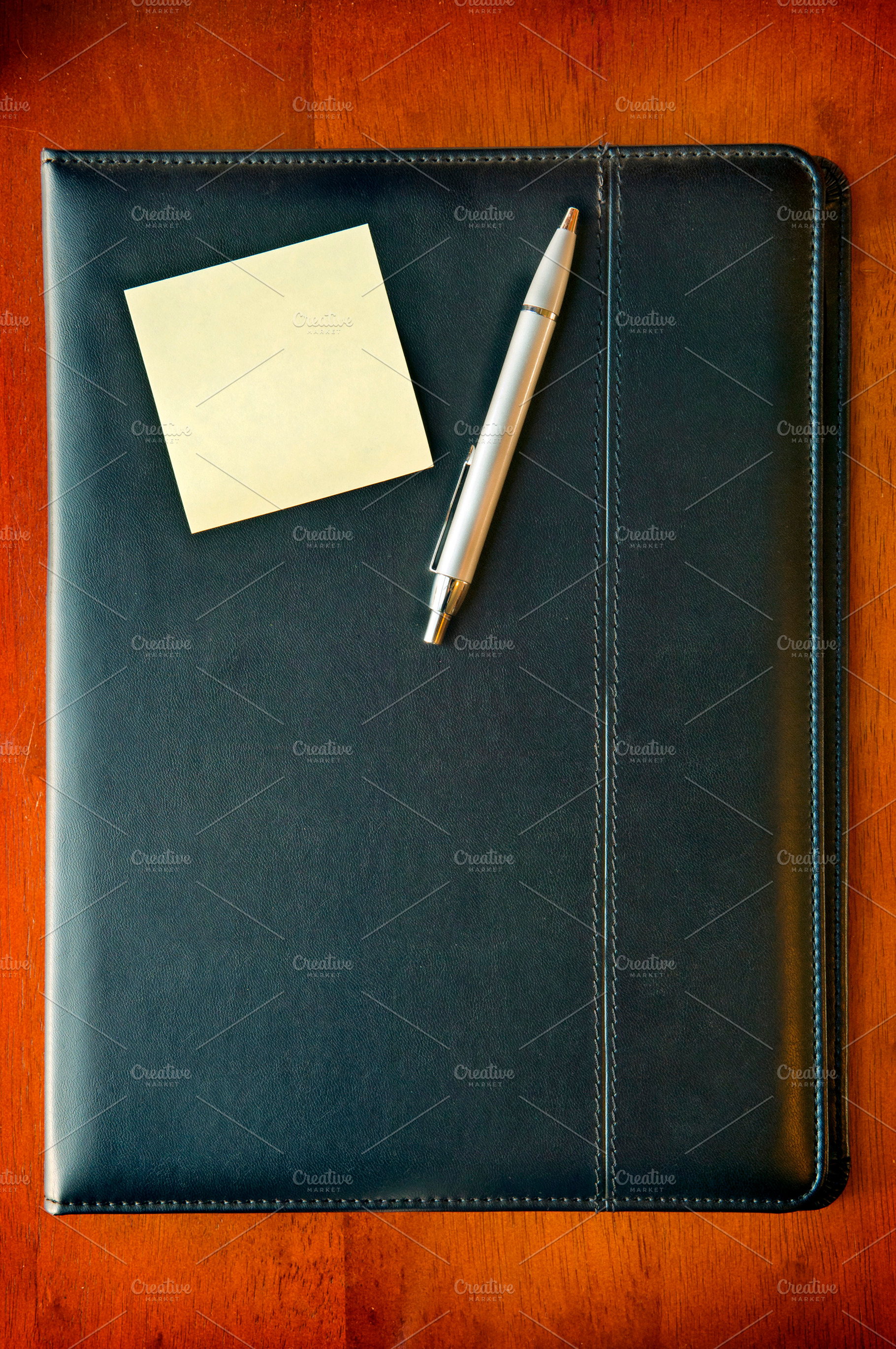 Executive Folder with note and pen, a Business Photo by THP Creative