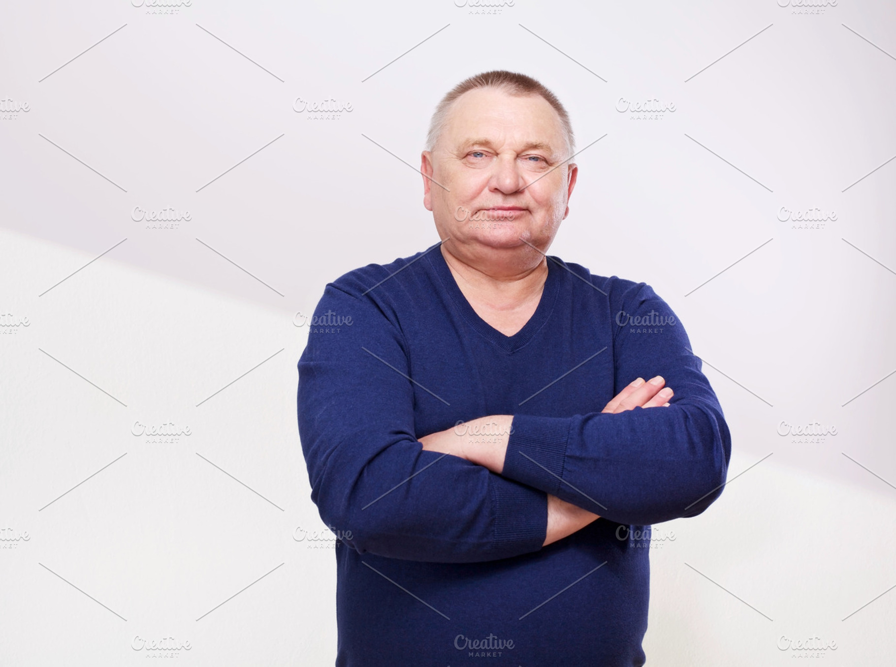 Middle aged man with crossed arms