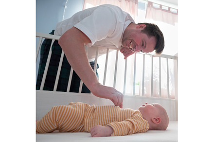Young man playing with his little, a Person Photo by Koldunova