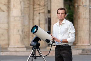 Man adjusting telescope for astronom, a School & Education Photo by Elena Vagengeim