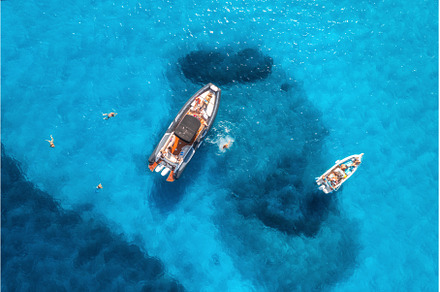Aerial view of yachts and swimming, a Nature Photo by den-belitsky