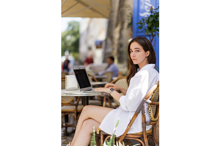 Young woman in white shirt using her, a School & Education Photo by serkum