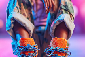 Vibrant street style with orange sneakers, a Sports & Recreation Photo by AlyaAnd