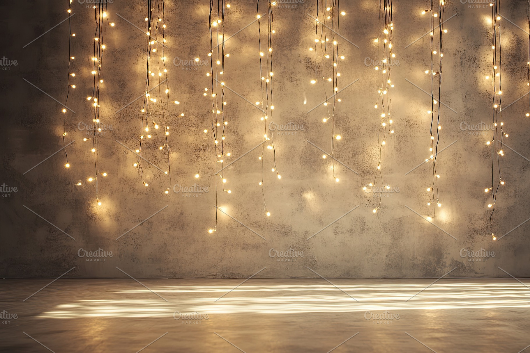 Golden garland on wall background, a Background Photo by AlyaAnd