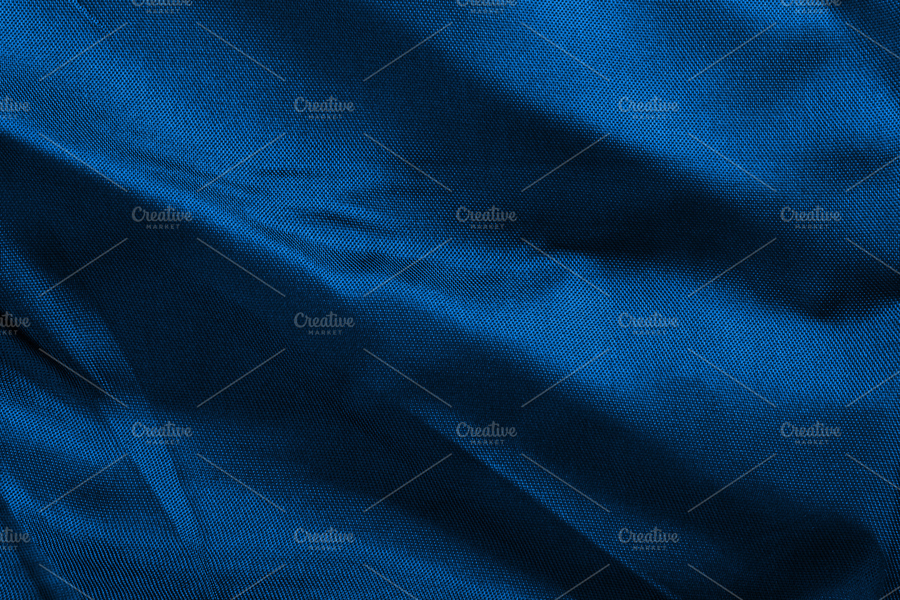 Close-up of elegant blue fabric with flowing folds and subtle te, a Background Photo by Ales Munt