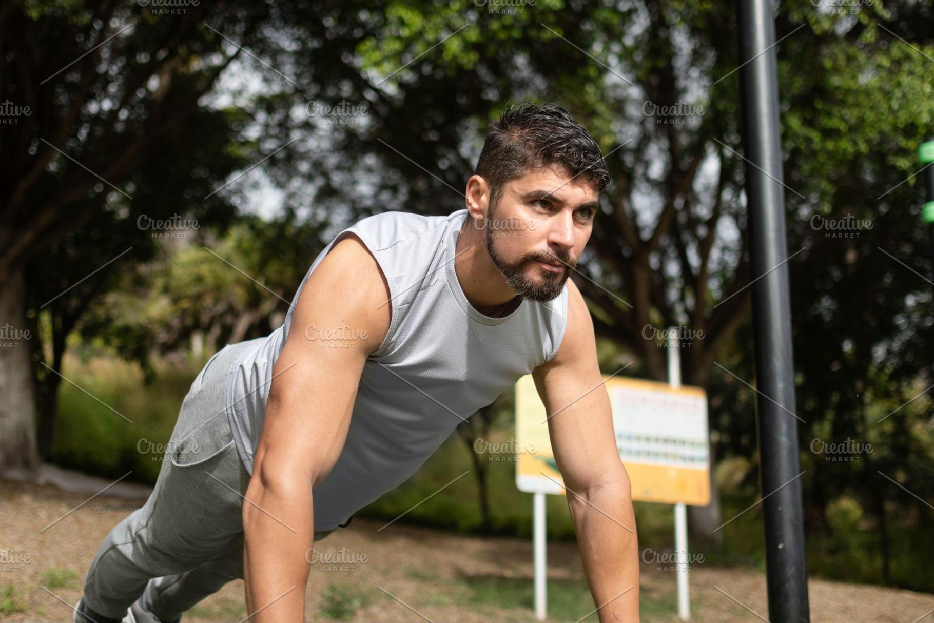 Young man doing push-ups workout in park outdoors, a Sports & Recreation Photo by etorres69