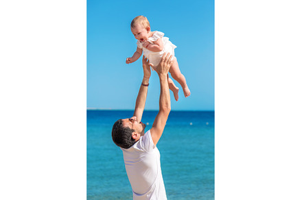 The father tosses the baby against, a Person Photo by yanadjana