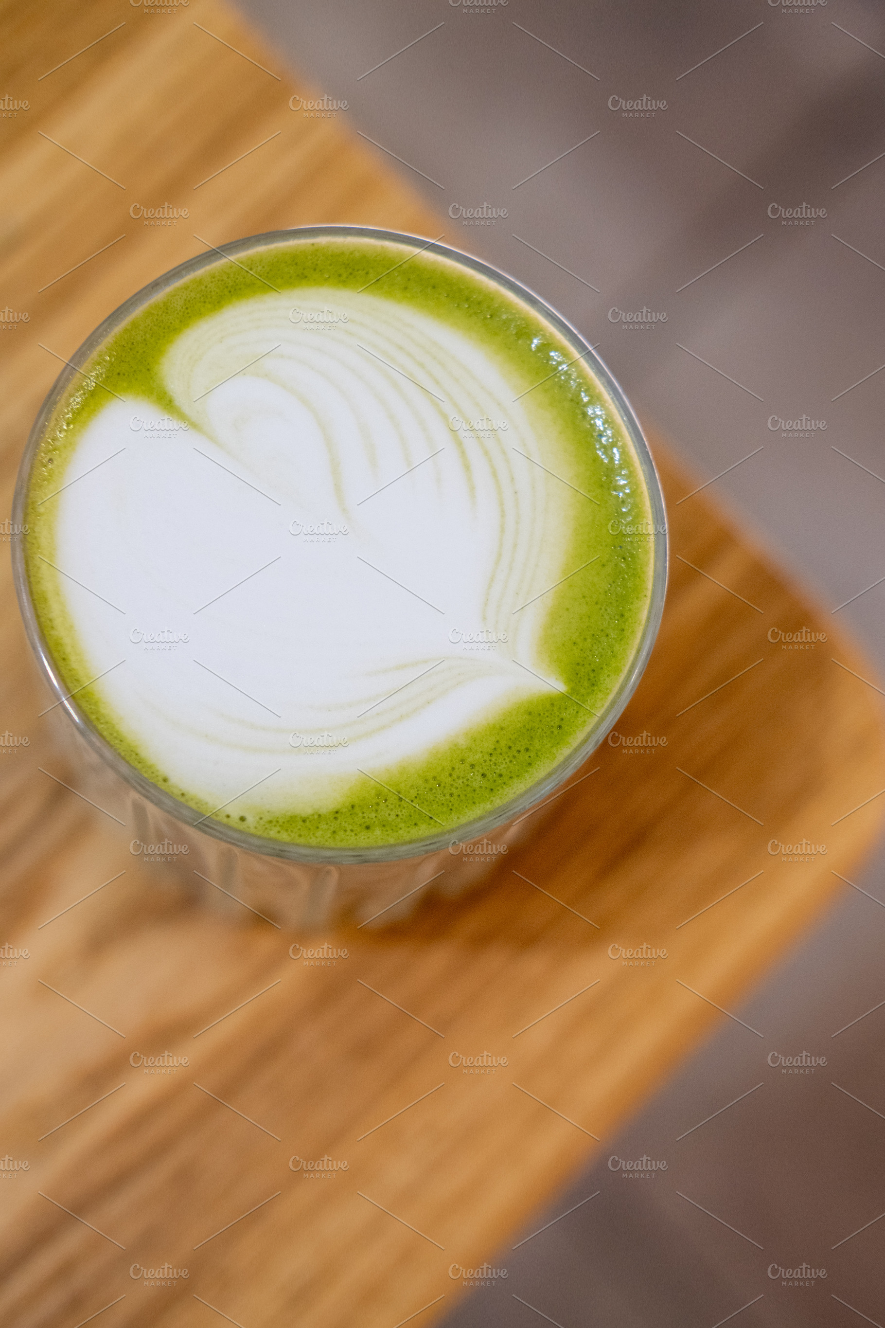 Natural beverage served matcha glass garnished, a Food & Drink Photo by Photo Drive Studio