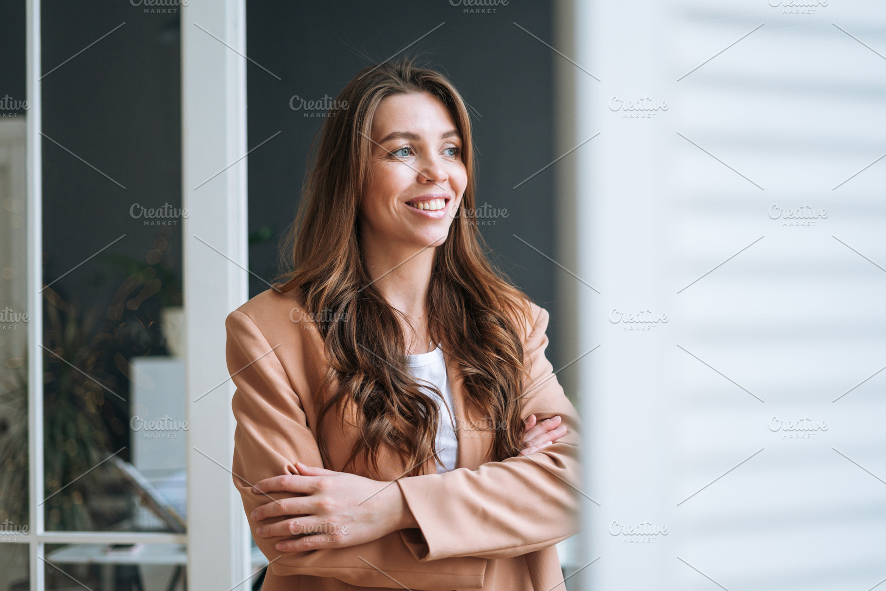 Young businesswoman near window, a Business Photo by Galina_Zhigalova