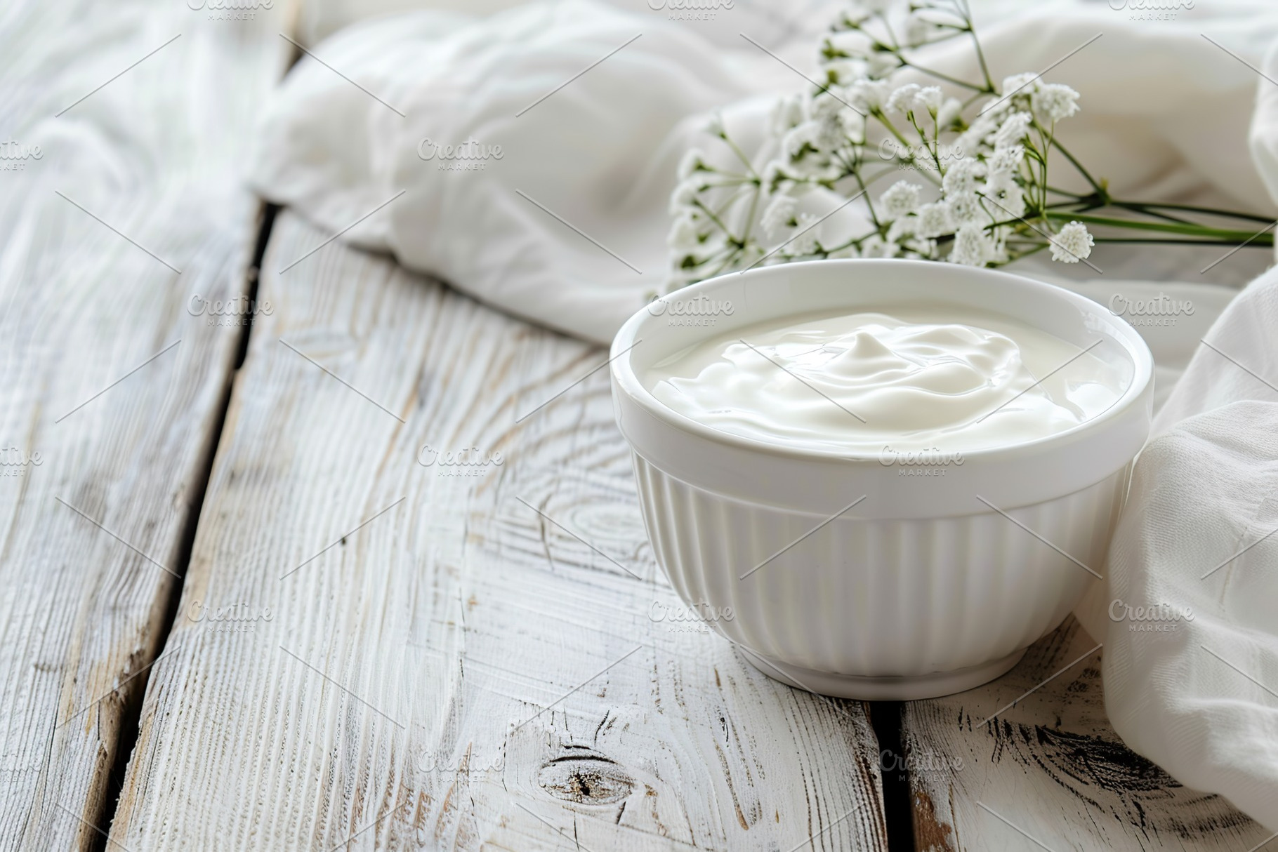 Bowl with white yogurt and napkin on wooden table, a Food & Drink Photo by AlyaAnd