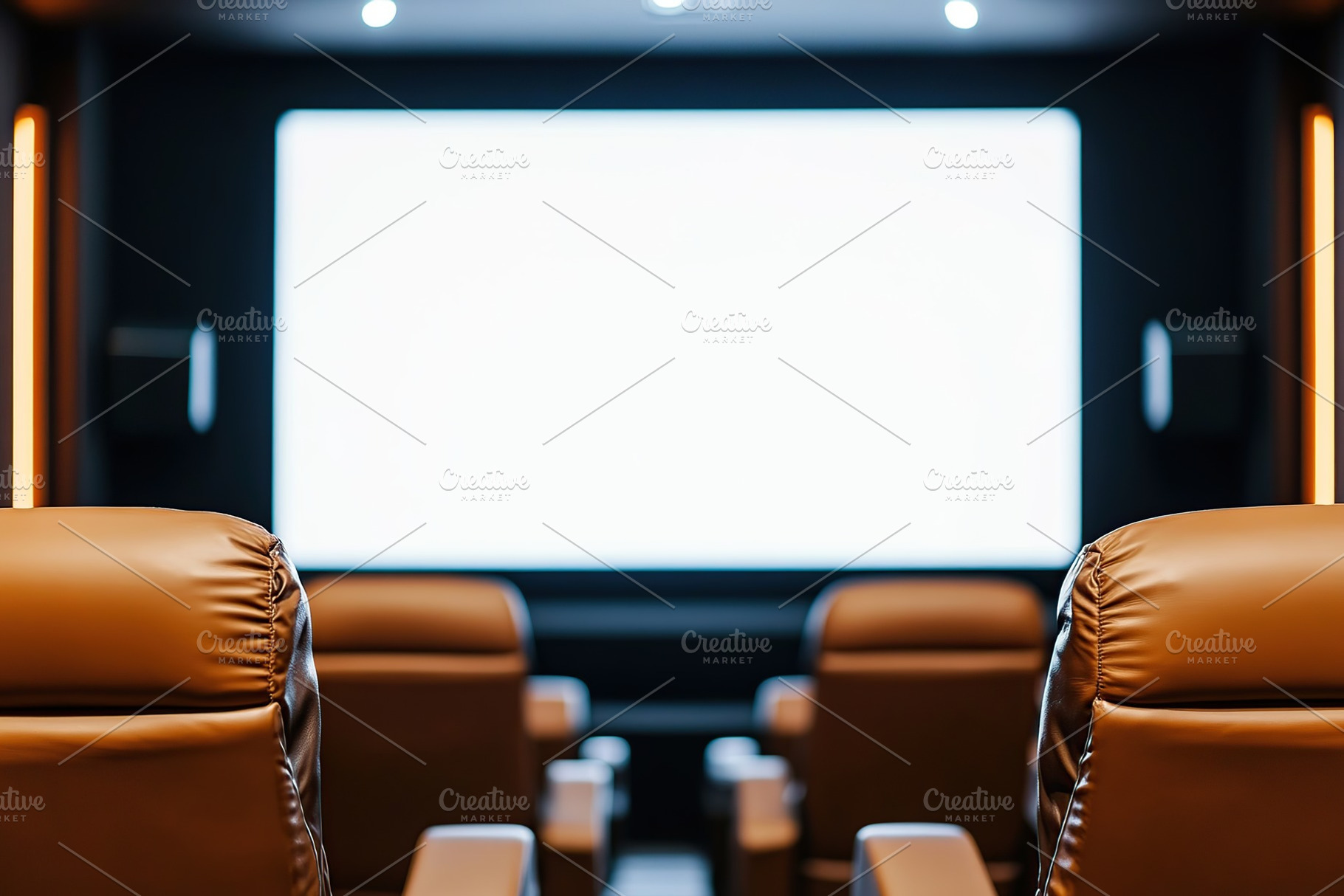 Empty comfortable seats in a cinema facing a large blank white screen., an Arts & Entertainment Photo by AlyaAnd