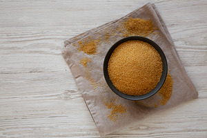 Organic Demerara Sugar in a Bowl, top view. Copy space., a Food & Drink Photo by LiudmylaChuhunova