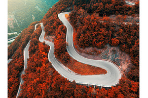 Aerial view of mountain curvy road, a Transportation Photo by den-belitsky