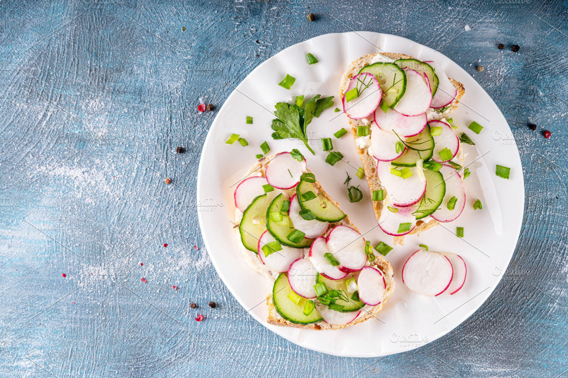 Breakfast sandwiches with cream cheese, radishes, cucumber and f, a Food & Drink Photo by Rimma