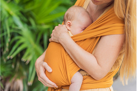 Mother holding her little baby in a