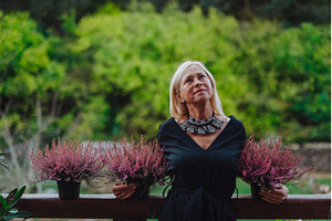 Mature woman standing by potted, a Nature Photo by HalfPoint