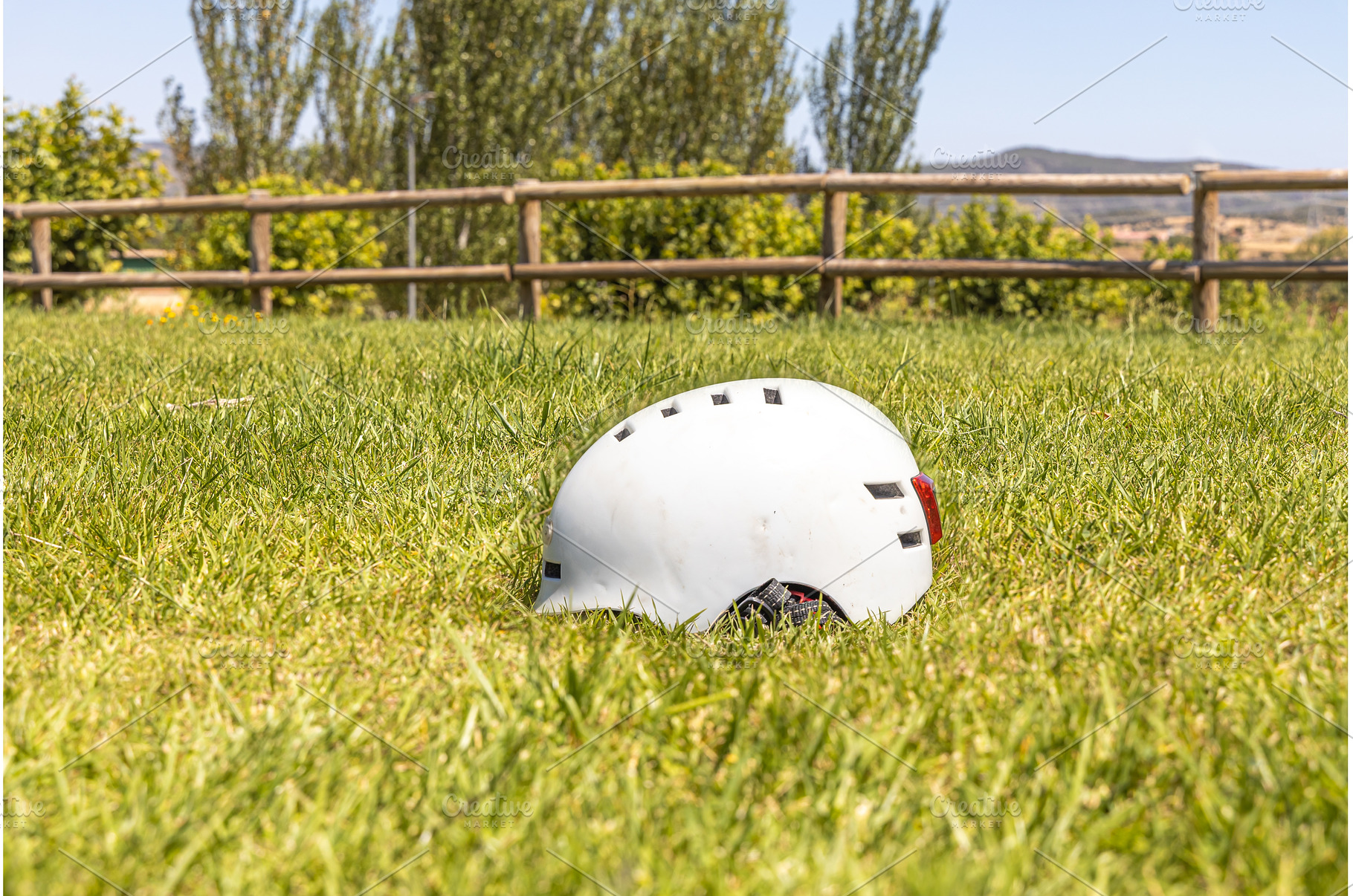 A white helmet on the green grass, a Technology Photo by Illustrations&photos