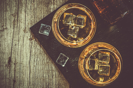 Cognac in glasses on rustic backgrpund stock photo containing cognac and glass, a Food & Drink Photo by NaumenkoOS