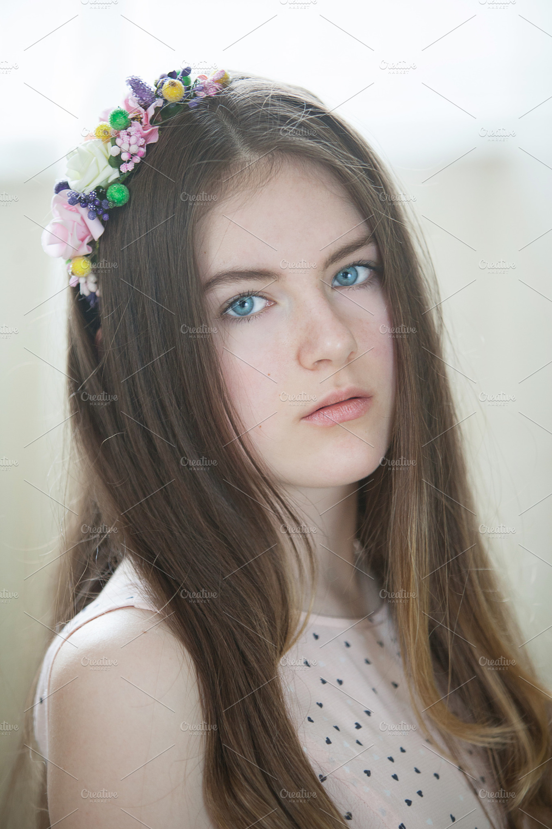 Girl with a flower wreath stock photo containing girl and calm, a Person Photo by AlinLyre