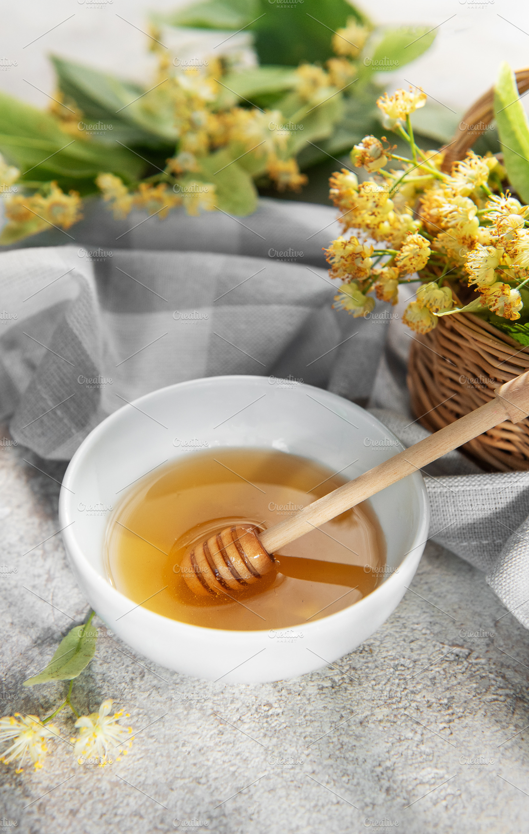 Linden honey with dipper and fresh basswood flowers, a Food & Drink Photo by Olena Rudo