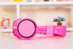 Headphones on table stock photo containing plastic and eye