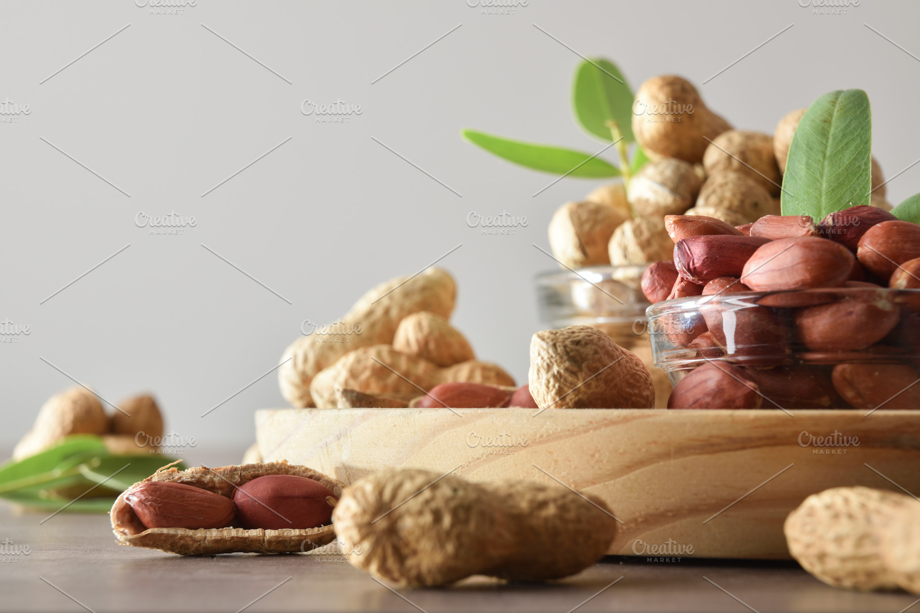 Background with peanuts in containers on a wooden table, a Food & Drink Photo by Davizro's Market