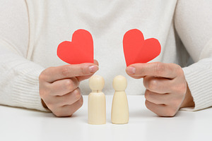 Pair of wooden men of the bride and groom, red heart, concept of, a Person Photo by ndanko
