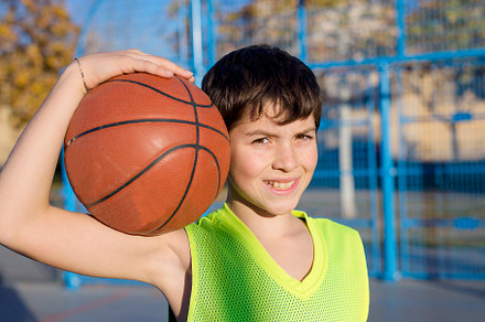 Young basketball player standing on stock photo containing activity and