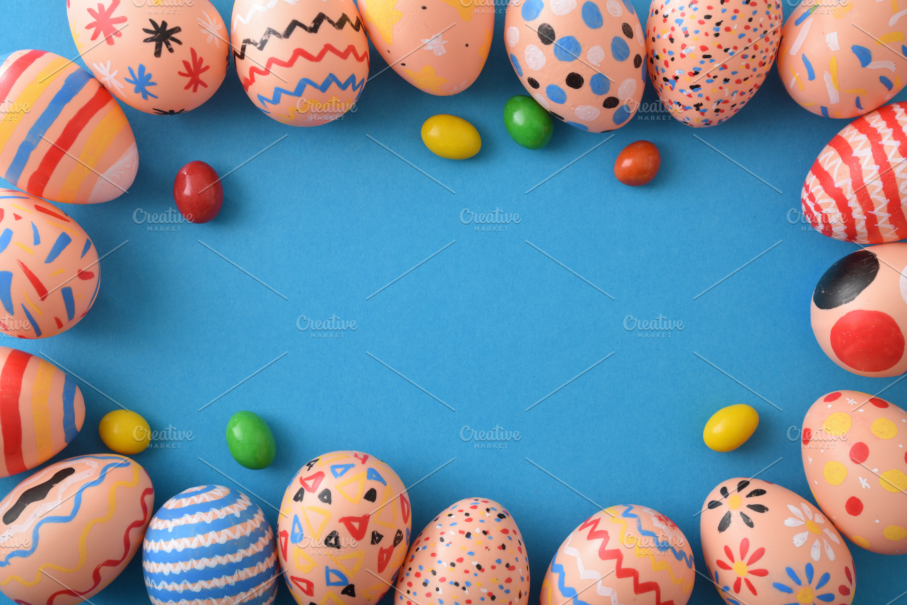 Colorful Easter Eggs Frame on Blue Background, a Holiday Photo by Davizro's Market
