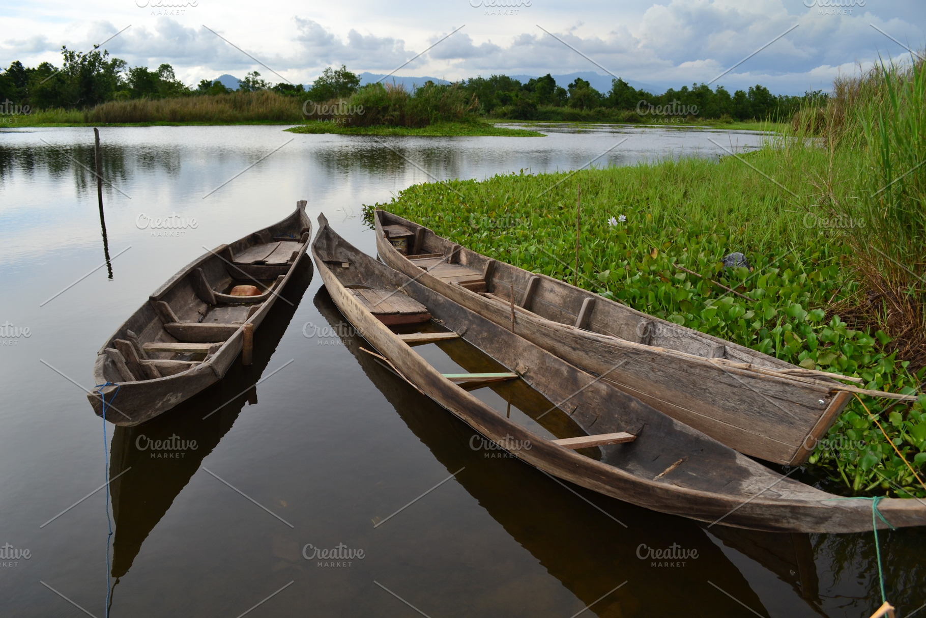 Traditional Wooden Canoes on a Calm, a Nature Photo by bastera